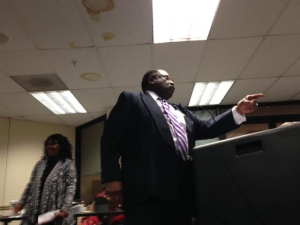 Rev. John Givens tells the Paterson board: "Reject this budget!"