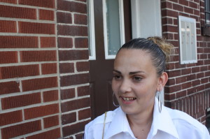 Sara Ferreira, outside her home on Pacific Street, describes her shabby treatment by school officials.